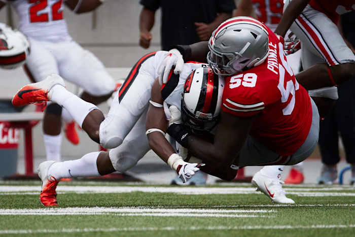 Isaiah Prince tackles an Oregon State player during the 2018 opener.